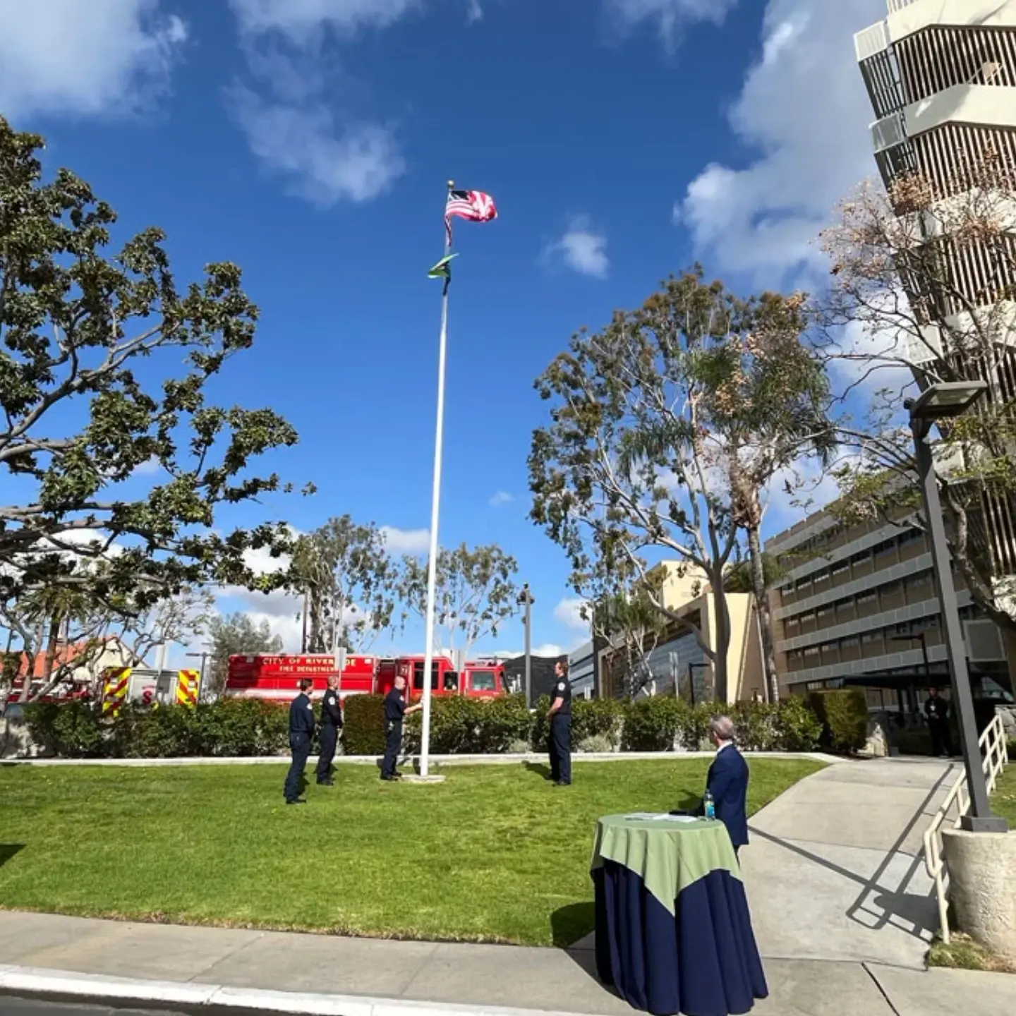 First responders raise the American and Donate Life flags on the flagpole before the Donate Life ceremony.