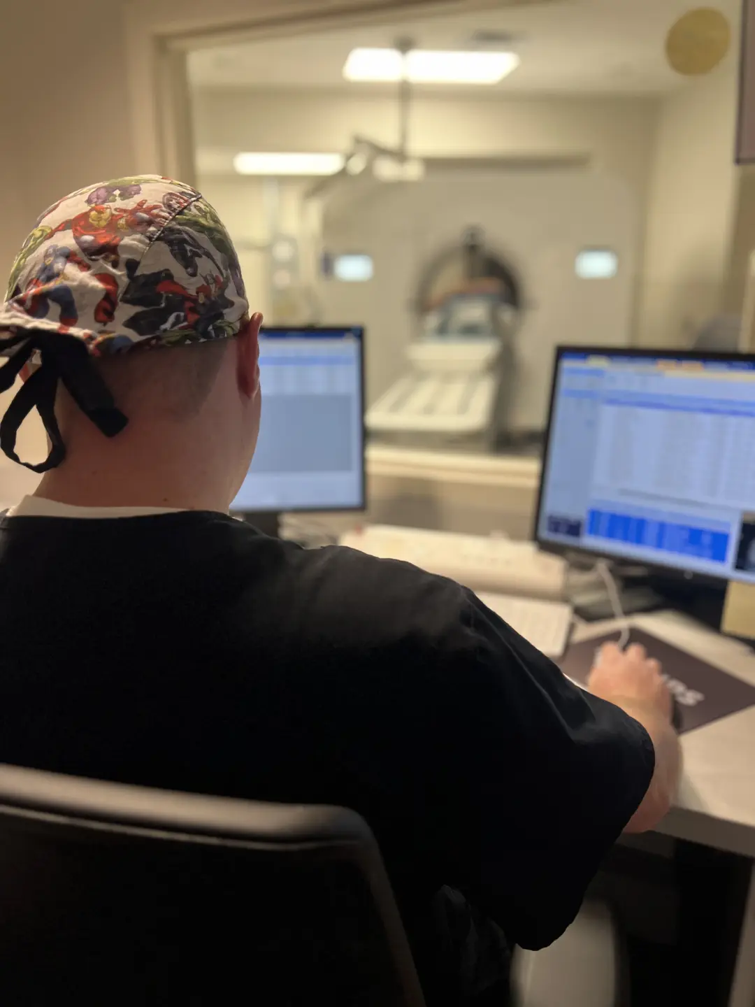 A radiologist working on a monitor.