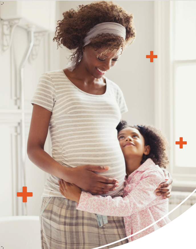 Pregnant mother and young daughter embrace.
