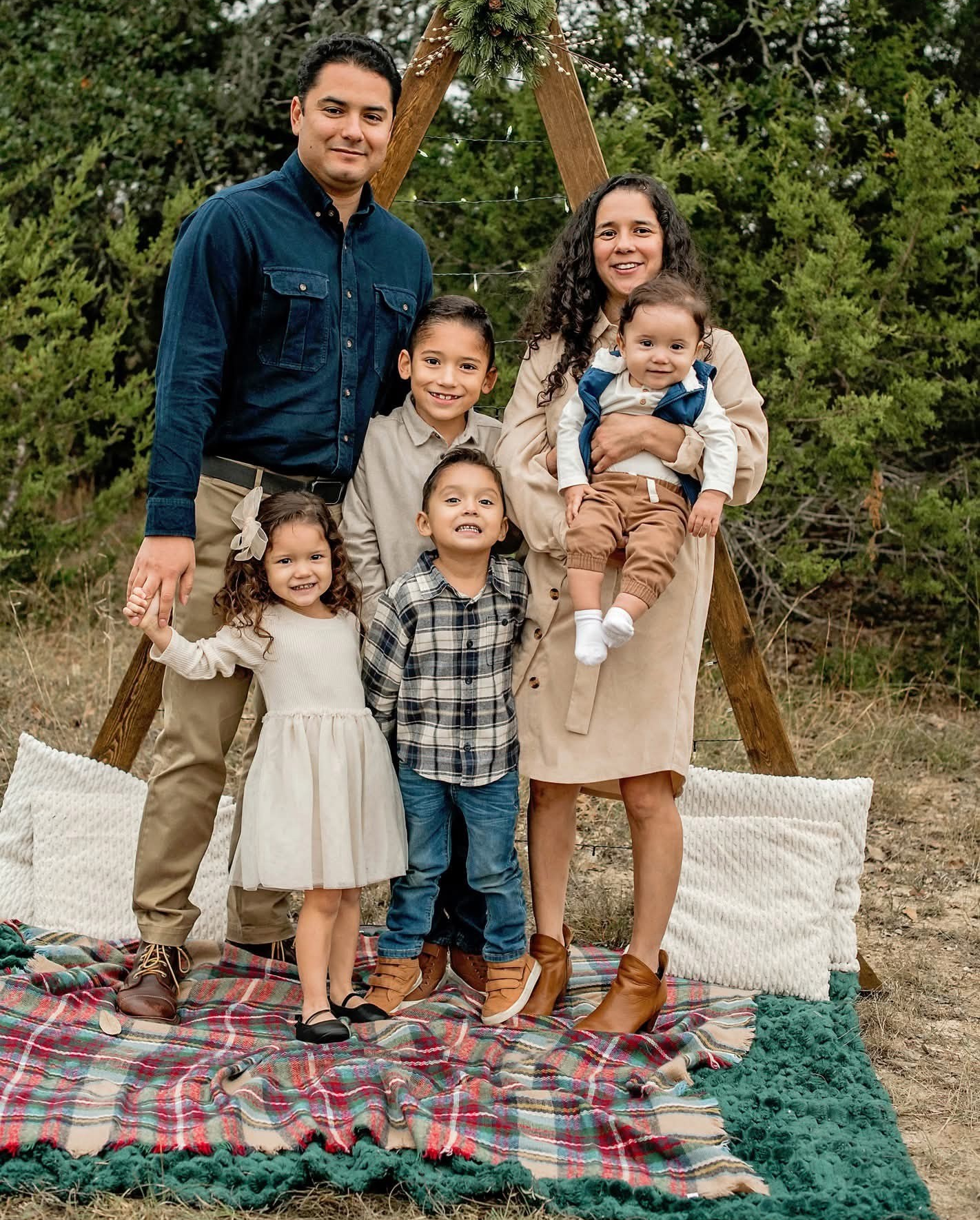 Nicole Camacho, a San Antonio mother and stage 3 colorectal cancer survivor, poses with her family.