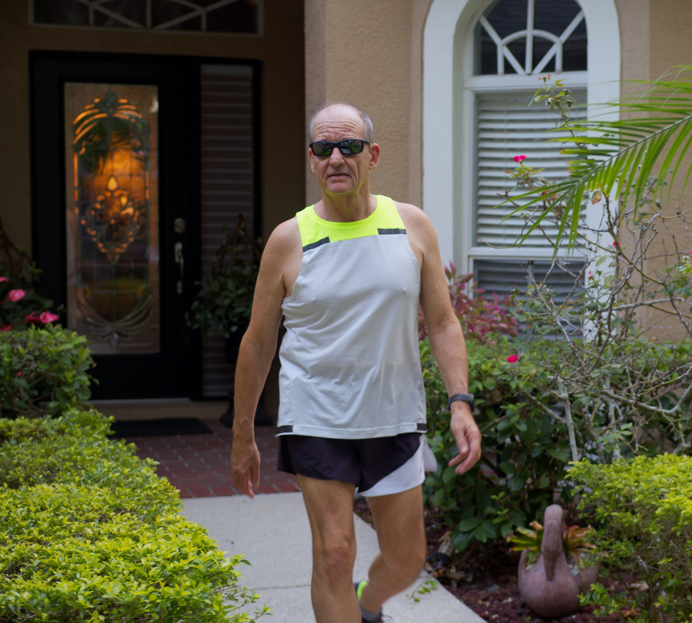 Drew Overlee leaving his house in jogging apparel