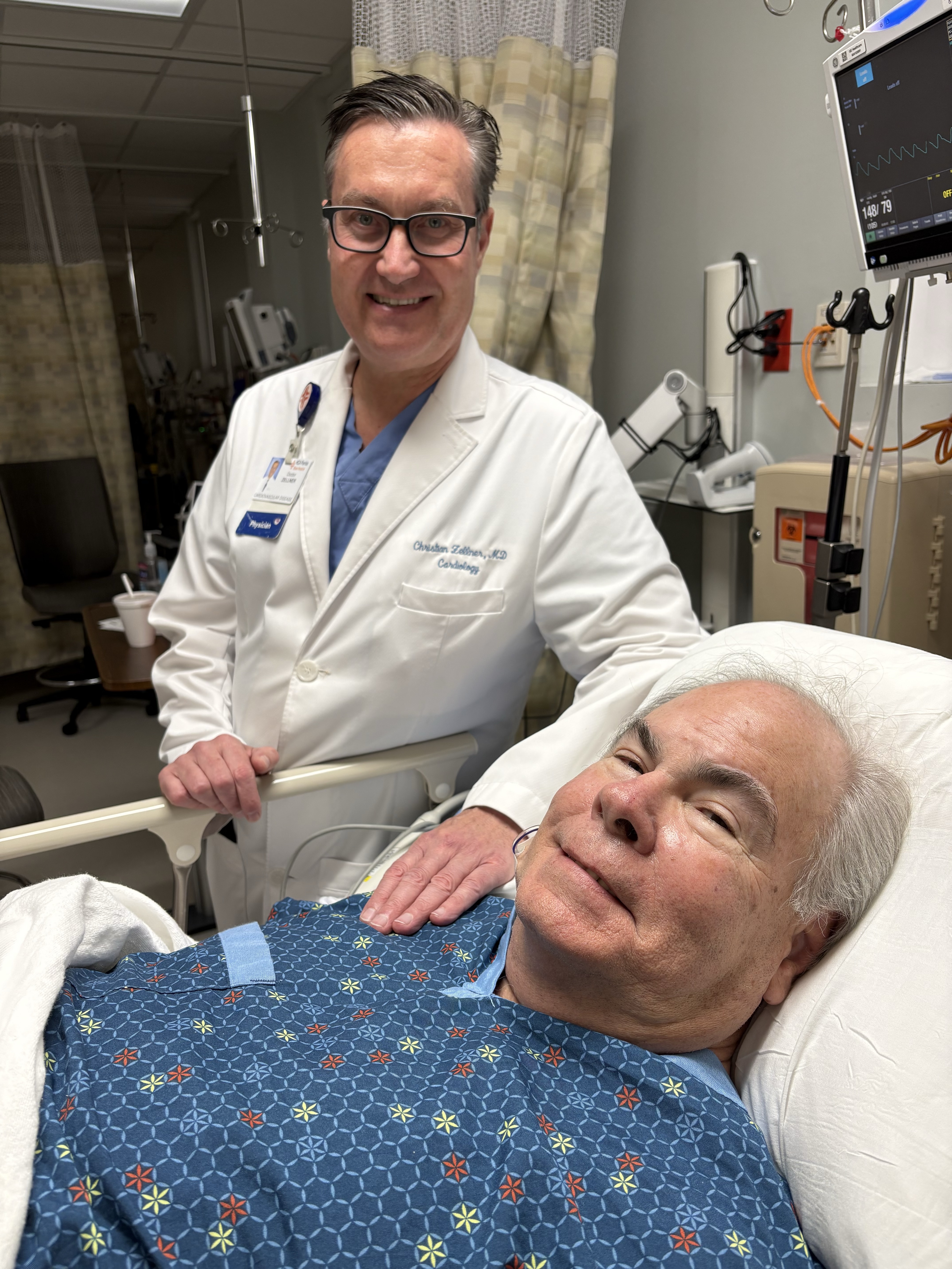 Dr. Christian Zellner checks on his patient, David Flail, following his renal denervation procedure, the first completed at Blake Hospital.