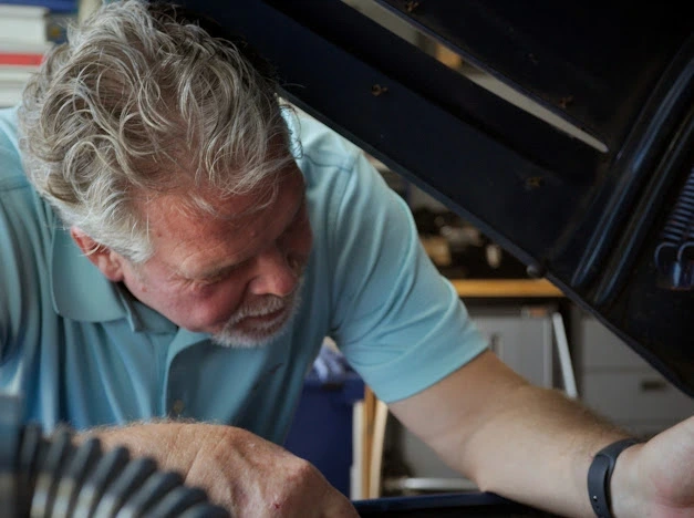 Darren Mason working on an engine.