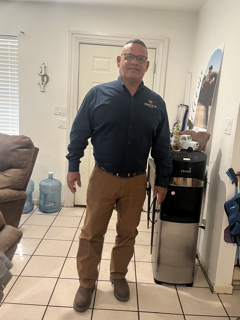 Arthur Guzman post surgery and healed standing in his home