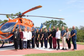 TriStar Skyline Medical Center trauma center team poses in front of a helicopter