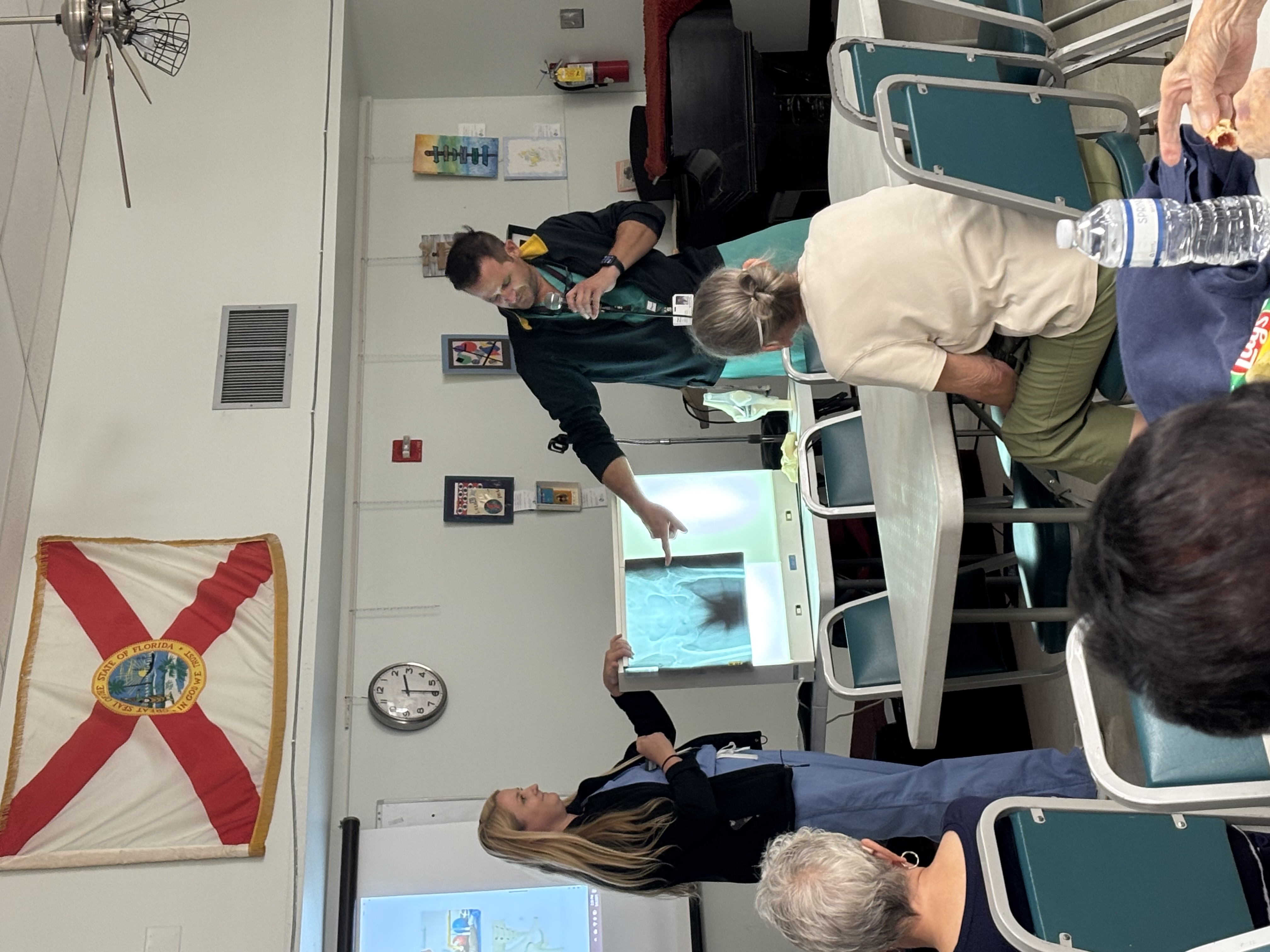 Dr. Patrick Mixa leading a conversation on knee and hip replacements in a classroom