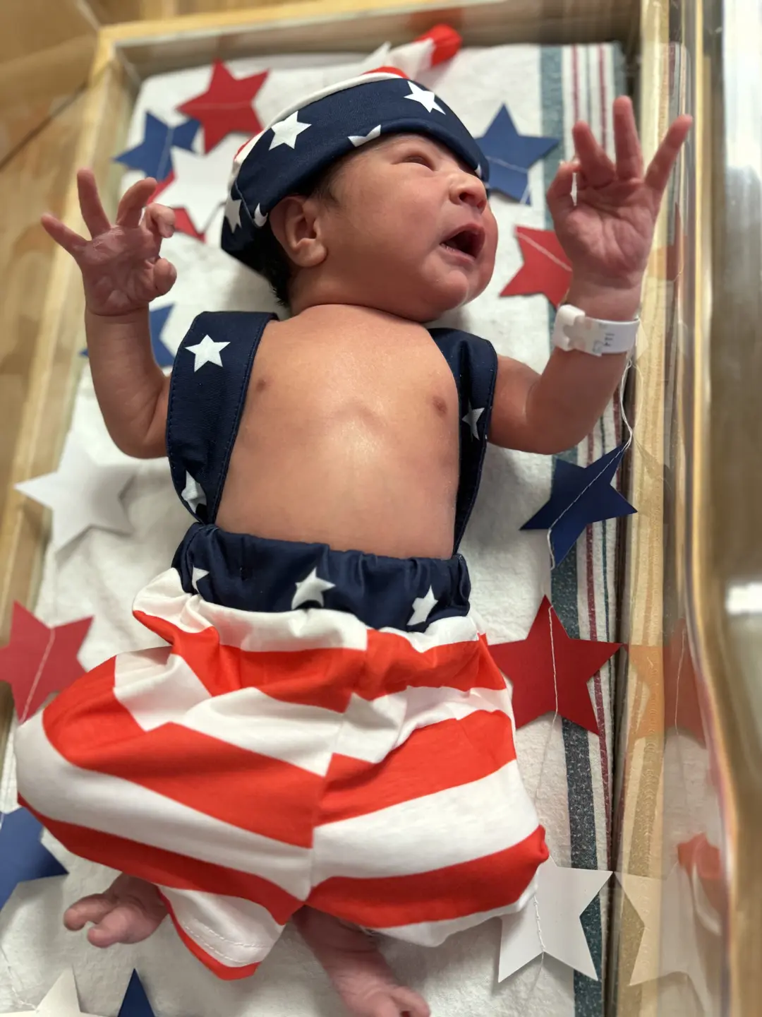 Newborns debuted in their red, white, and blue for the festive holiday