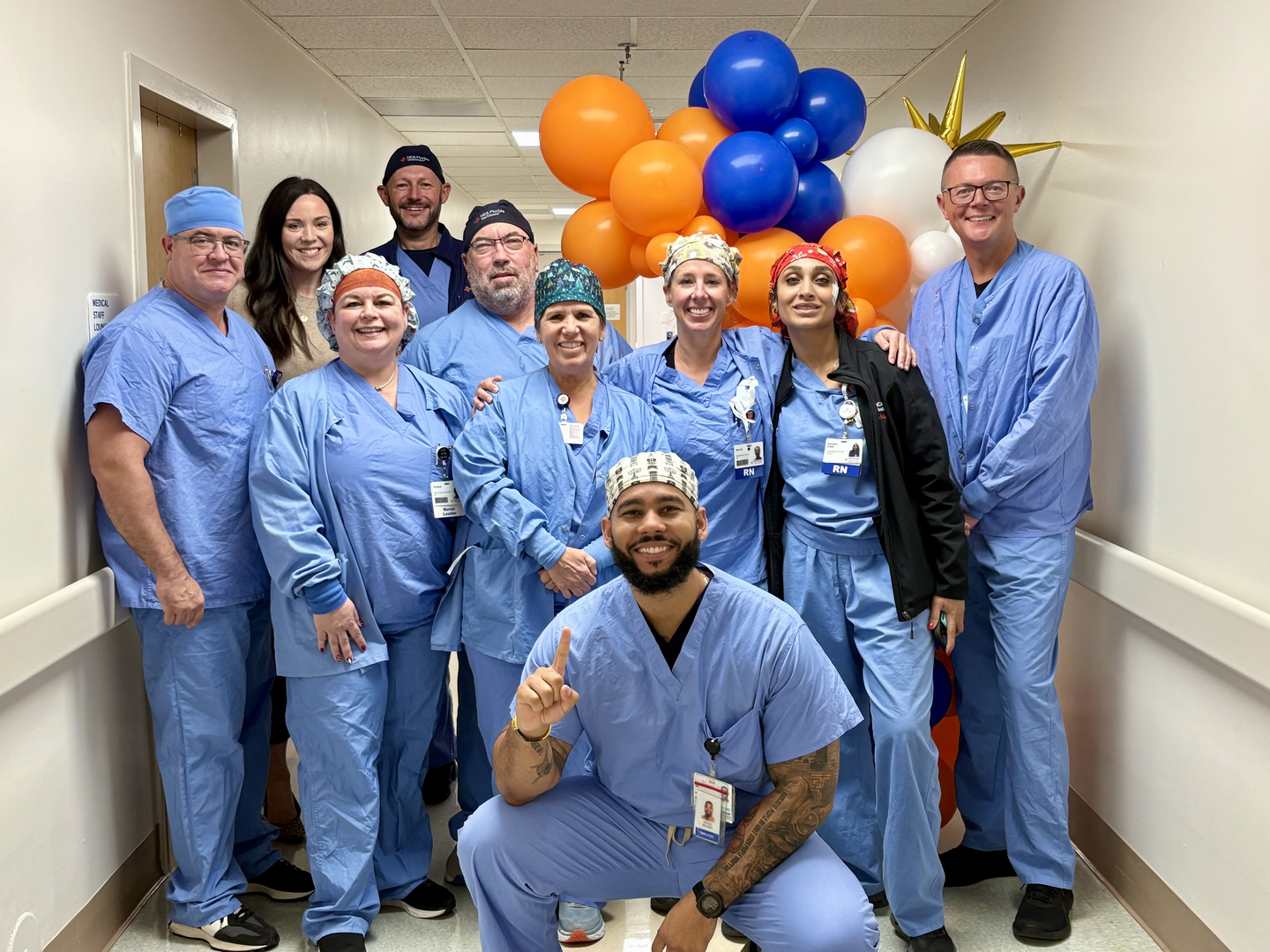 Dr. Yurich posing with surgical team after first robotic surgery.