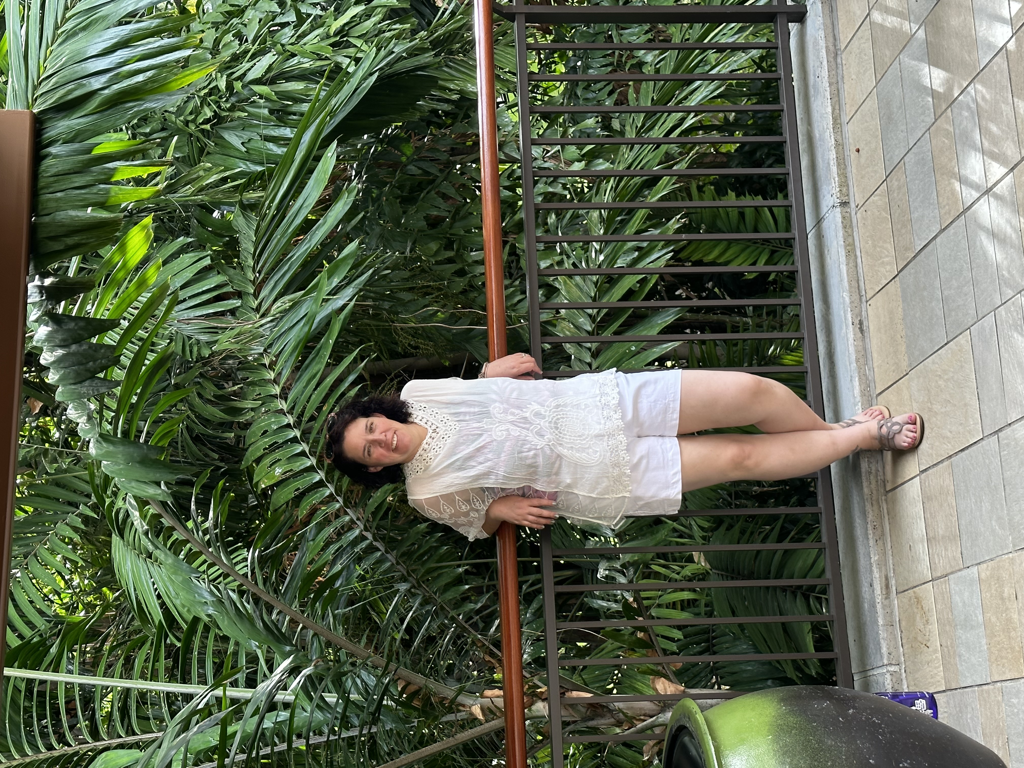 Liz standing in front of plants