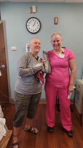Jenifer and Alyssa pose for a photograph inside the hospital.