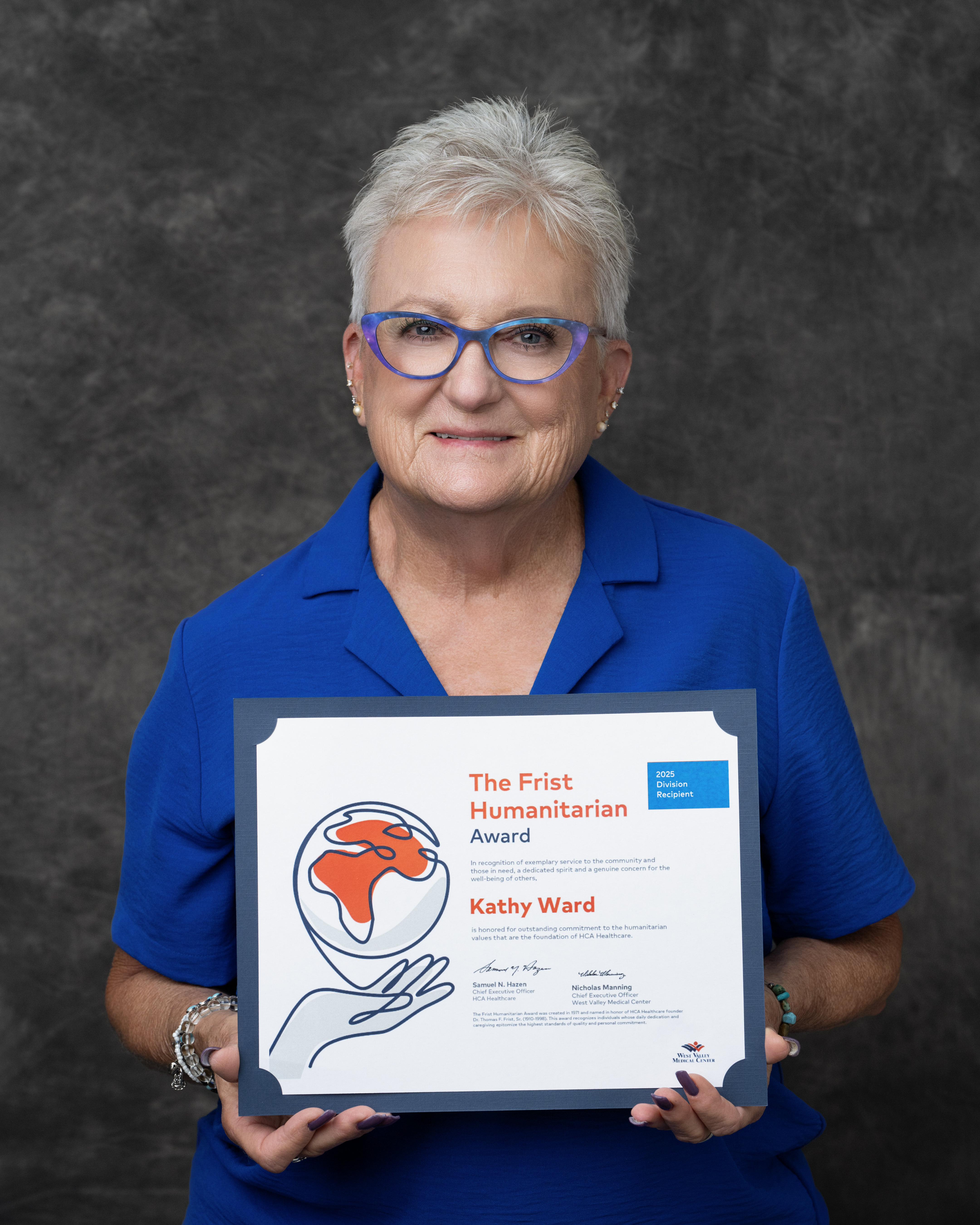 Kathy Ward poses with her Frist Humanitarian Award.
