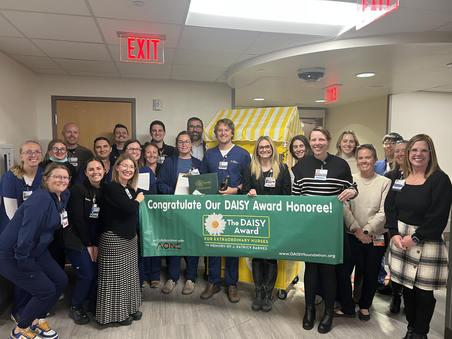 Hunter Askelson and colleagues celebrate his DAISY Award win.