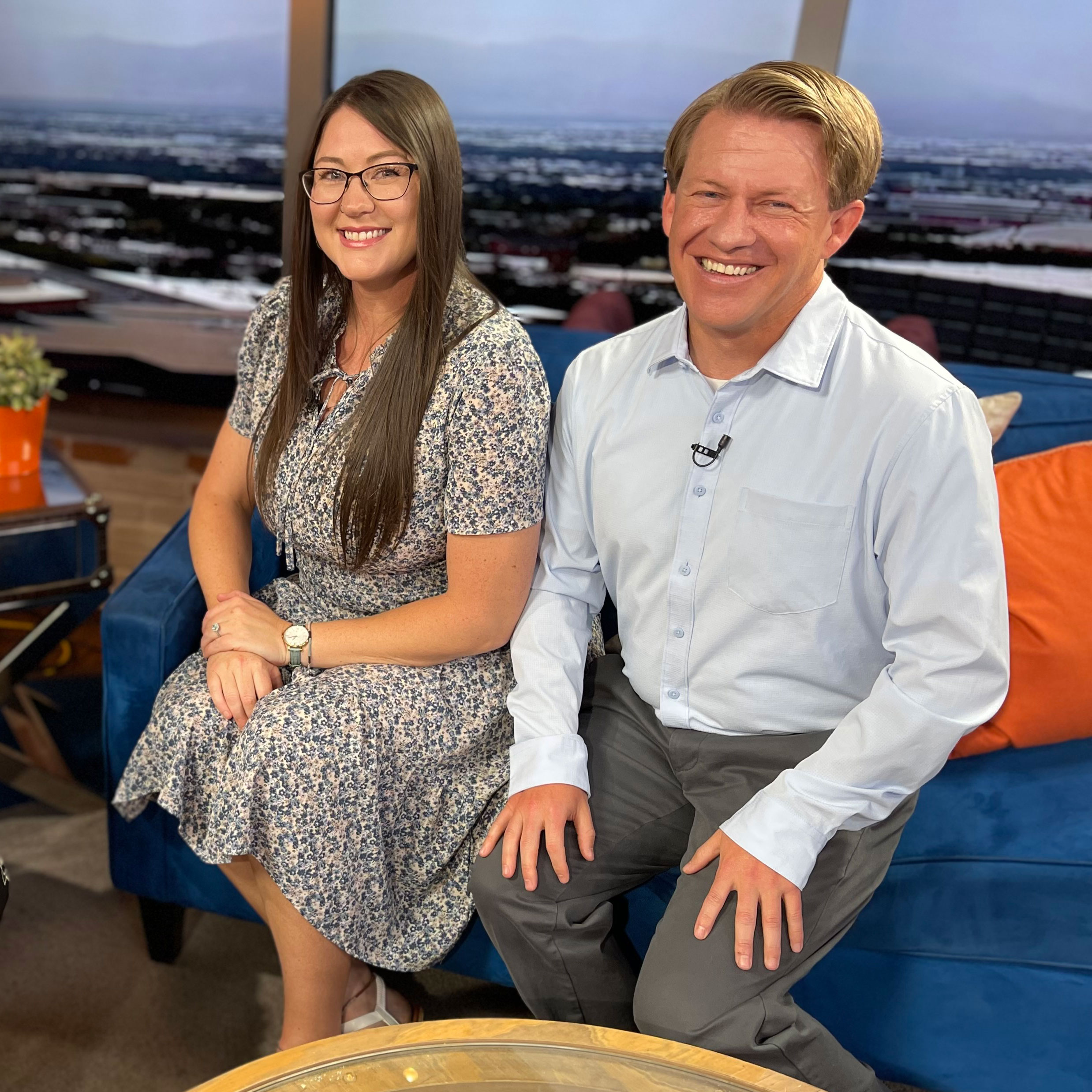 Ashley Conte and Dr. Kevin Jensen sitting on couch smiling at FOX13 The PLACE studio