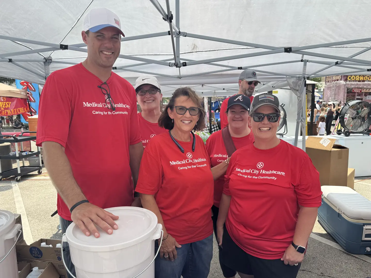Medical City Weatherford colleagues volunteer during the 2025 Parker County Peach Festival.