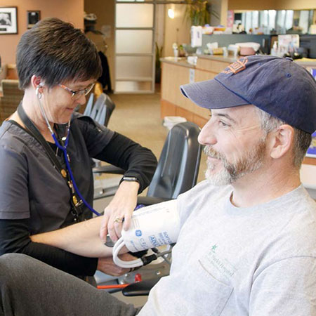 Rick Page getting his blood pressure read by a nurse.