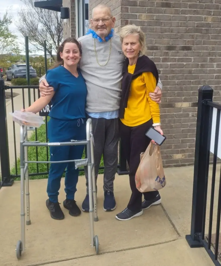 Pictured is rehabilitation colleague Elizabeth Klein with patient Michael Holton and his wife, Vicky Holton.