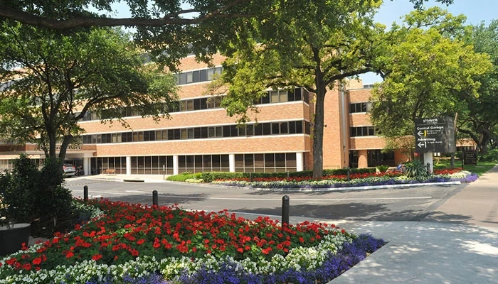 Exterior main entrance of St. David's Medical Center on a sunny day.