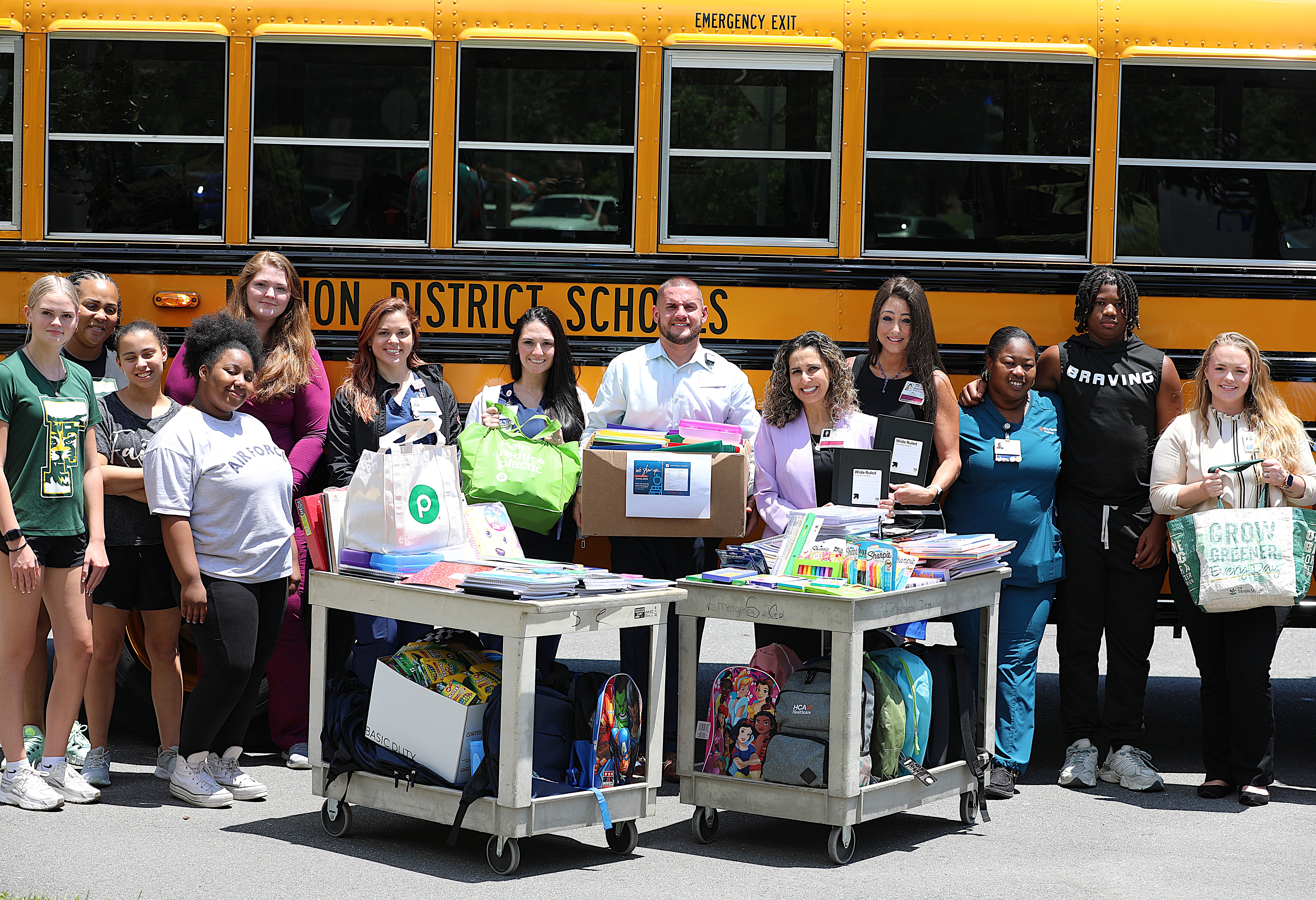 Florida Ocala and West Marion Hospital staff posing with school supply donation.
