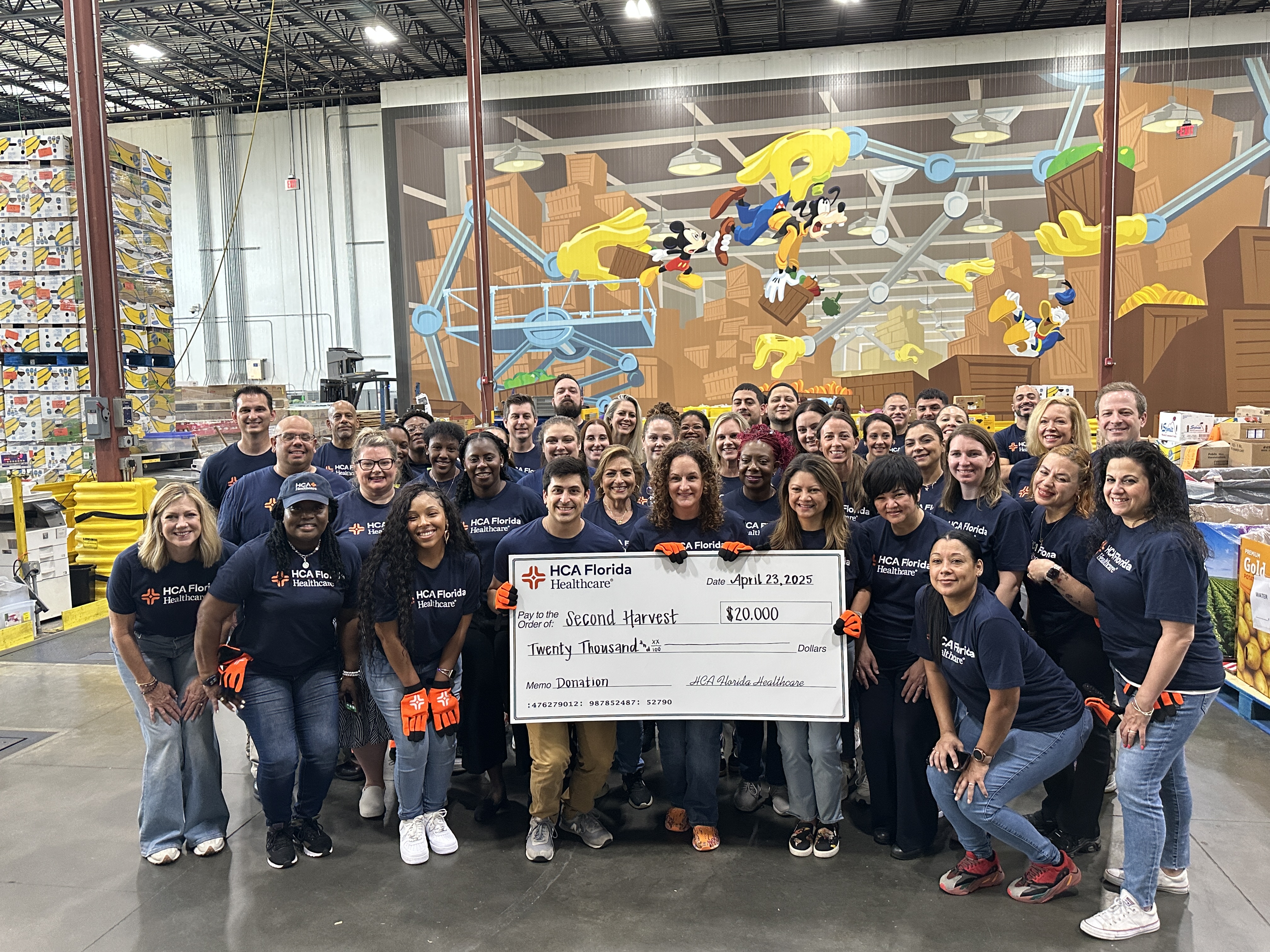 Photo of colleagues presenting a $20,000 check to Second Harvest Food Bank of Central Florida