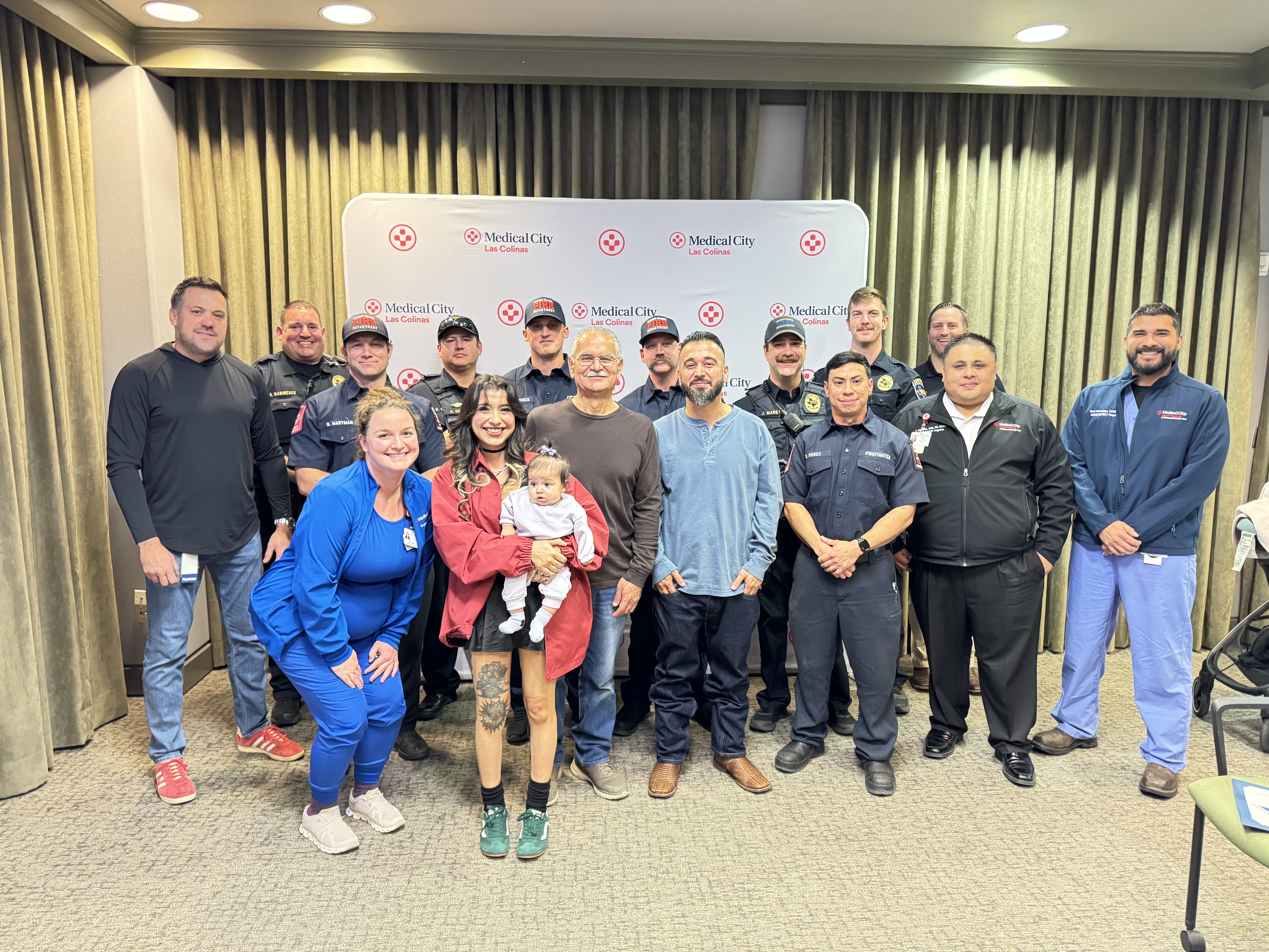Federico Gonzalez with his family, members of the Farmers Branch Police and Fire departments, and Medical City Las Colinas and Medical City Heart & Spine staff.