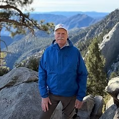 Mark standing in front of a mountain.