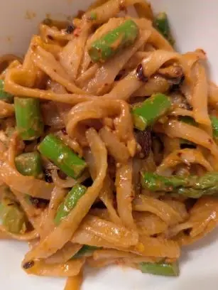close-up photo of a dish of noodles and scallions