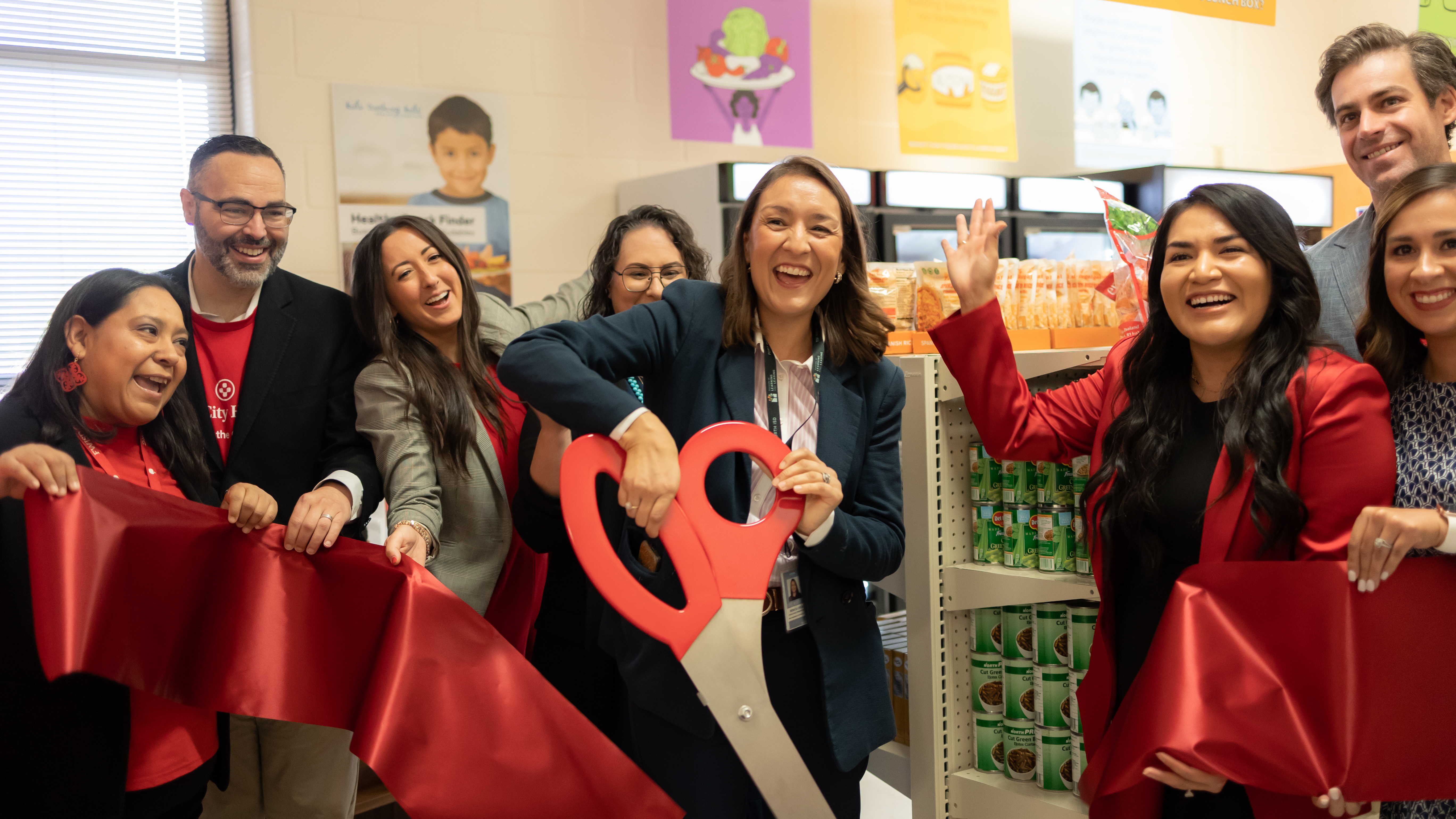 Ribbon cutting with large scissors