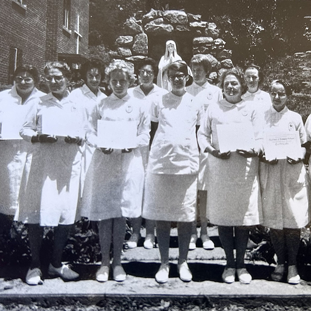 Photo of Rose and other team members at hospital ceremony when she was young.