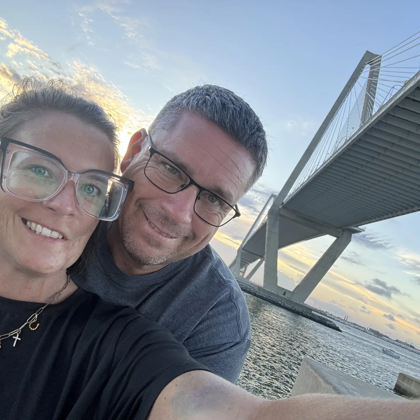 Lindsey photographed with her husband with the ocean behind them on their recent vacation