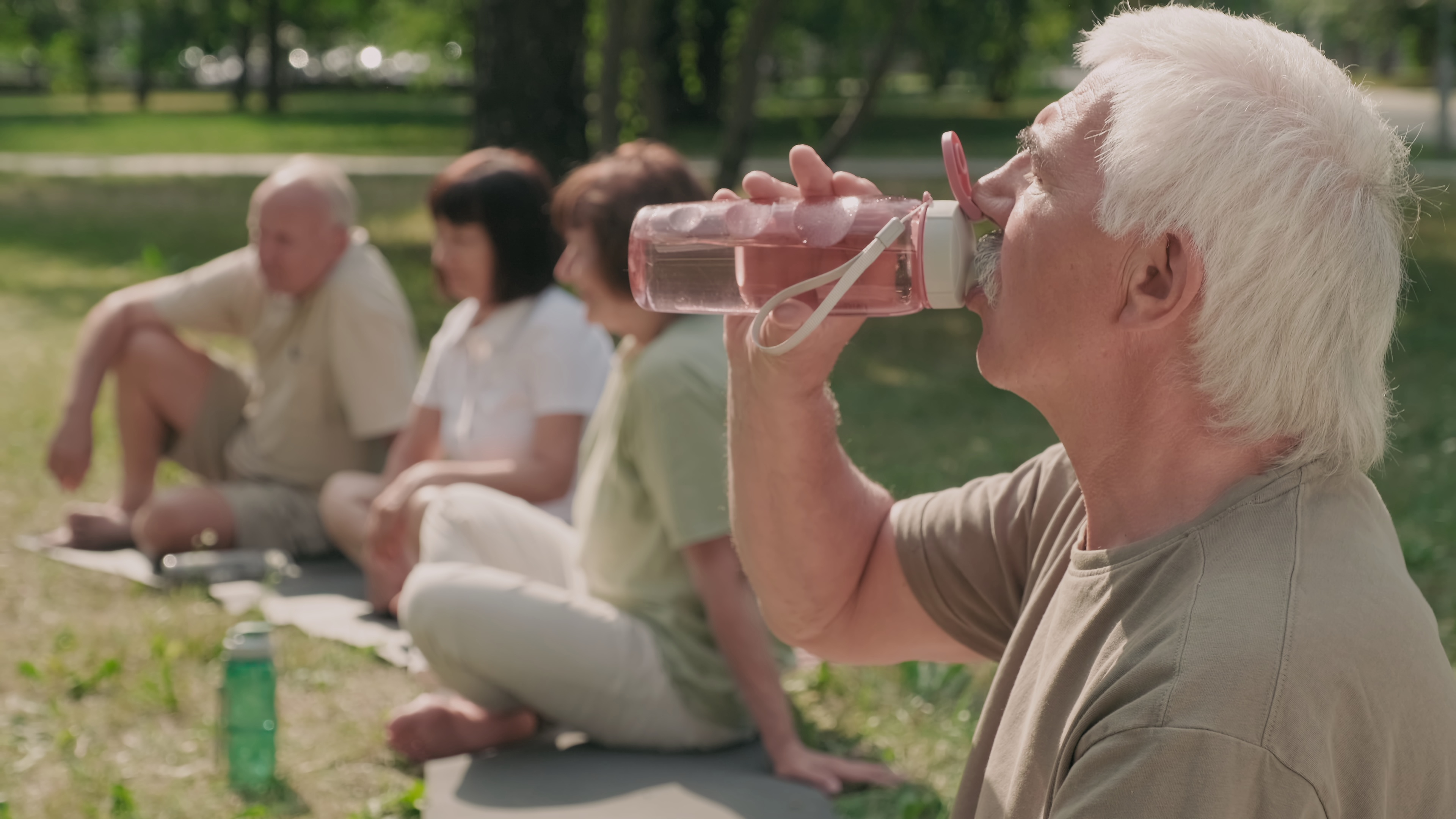 Man drinking water from a sport bottle
