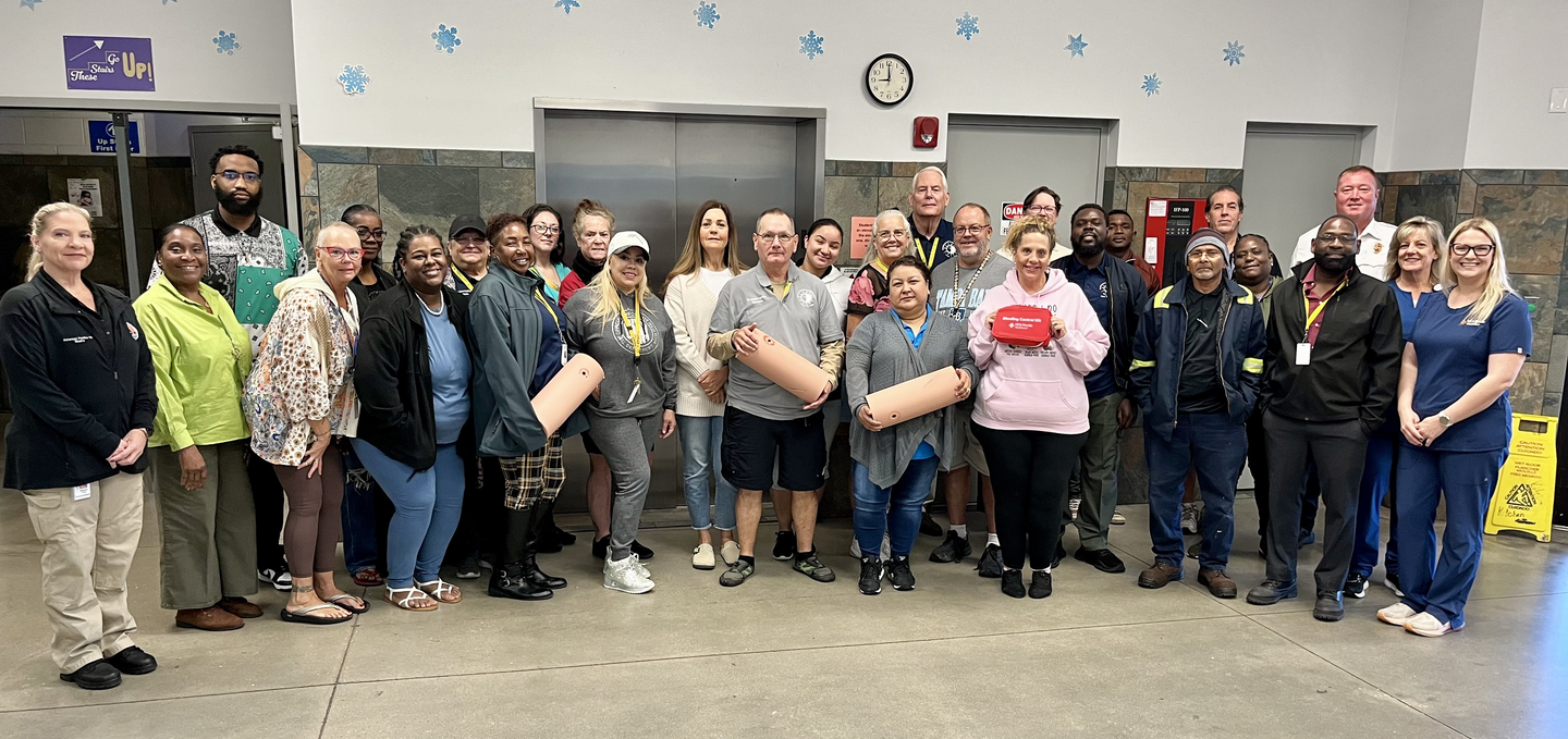 A group photo of the bus drivers who participated in the Stop the Bleed training