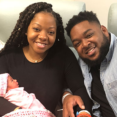 Tiffany Garth and her husband with baby Amarah