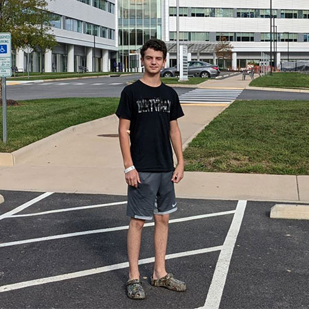 Stephen Yago standing in the parking lot of Chippenham Hospital.