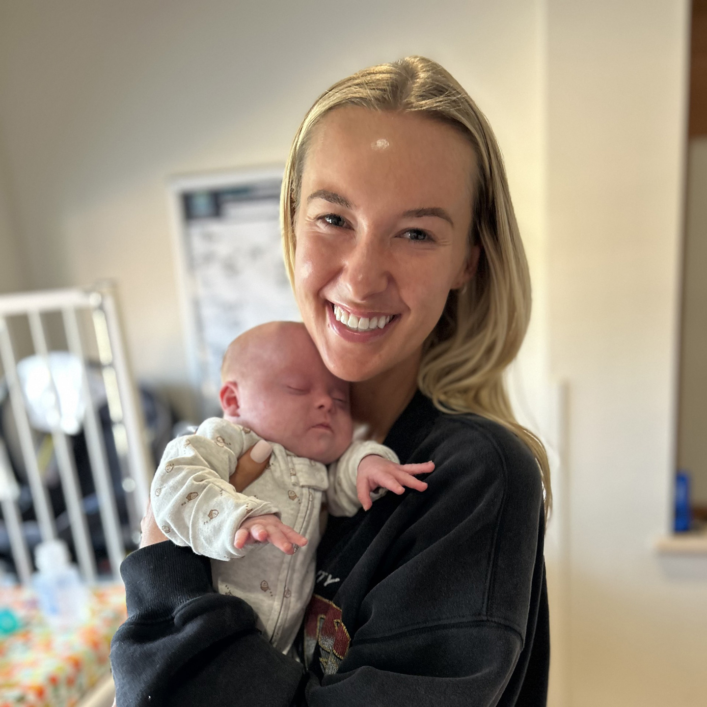 Bo being held by woman.