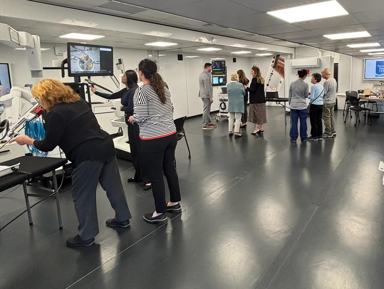 Local community members and Portsmouth staff check out the TOME Truck diagnostic equipment.
