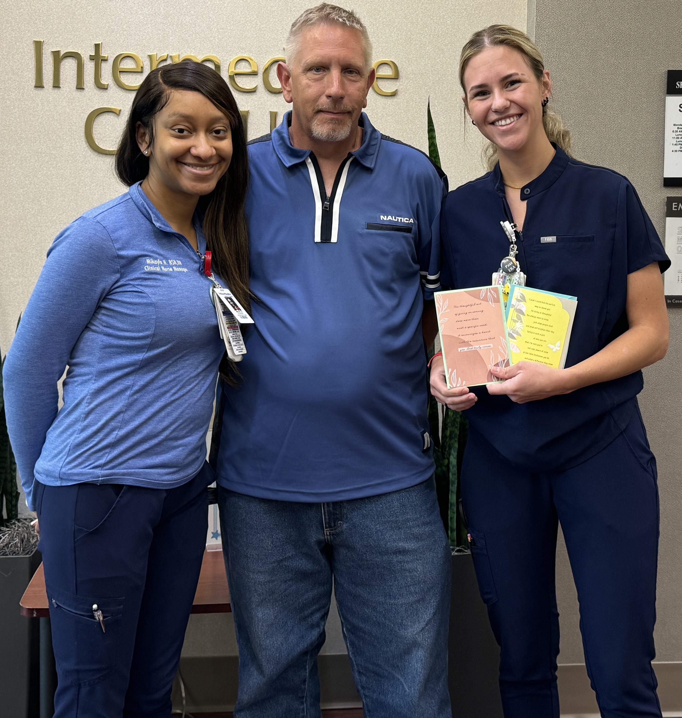  Mark Beck standing with his nurse Taylor and clinical nurse specialist Mikayla.
