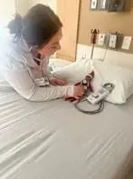 A nurse checking on Winston the Elf's heart rate.