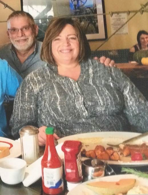 Amy Tranin poses while eating dinner.