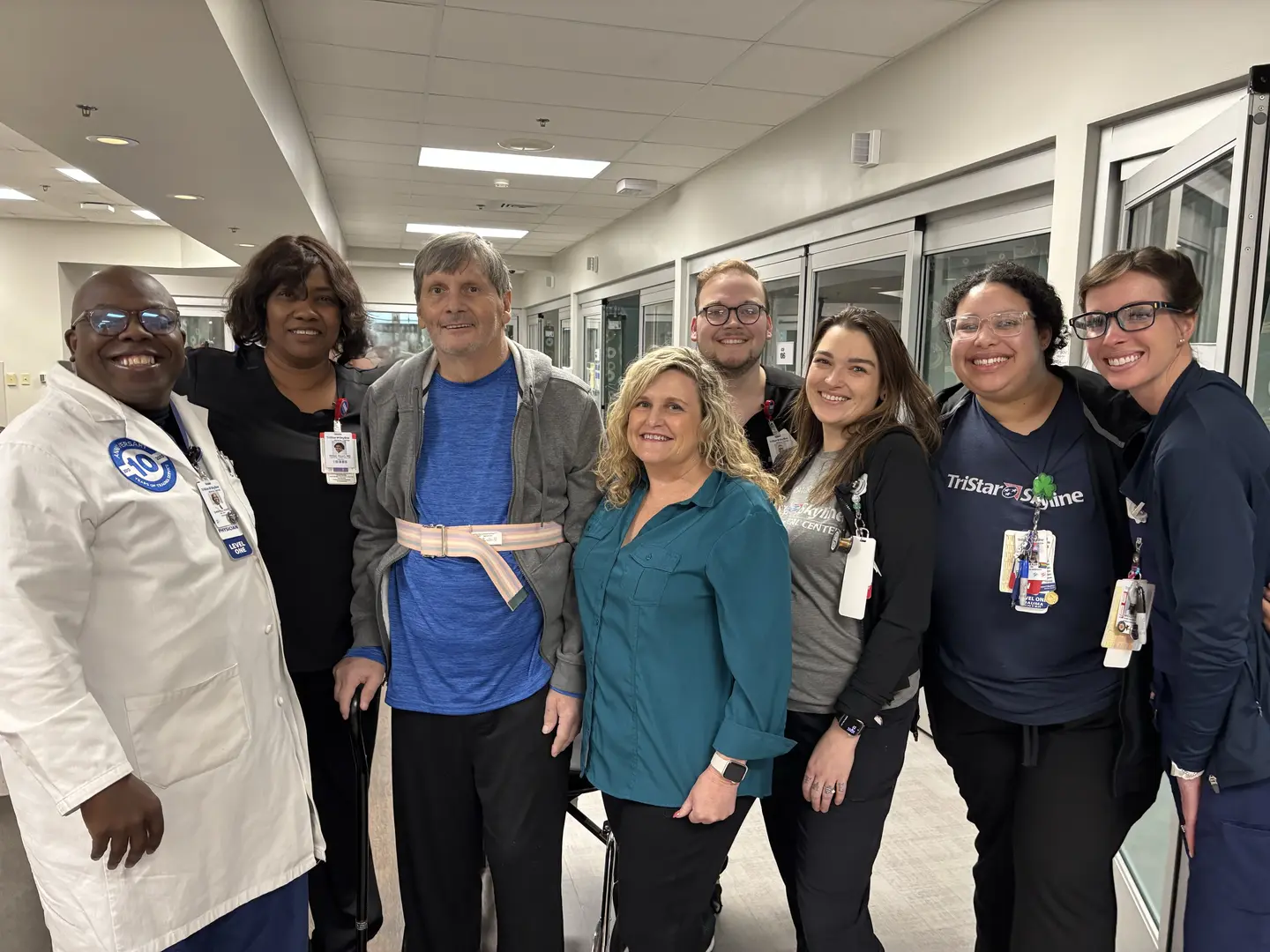 Trent Snead and wife, Renee, posing with Tristar ICU staff in hospital.