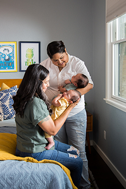 Vanessa Rodriguez and Doctor Elizabeth de la Garza holding Vanessa's babies.