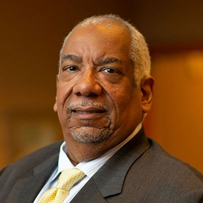Zoomed in head to shoulders of Dr. Henry Wicker Jr,