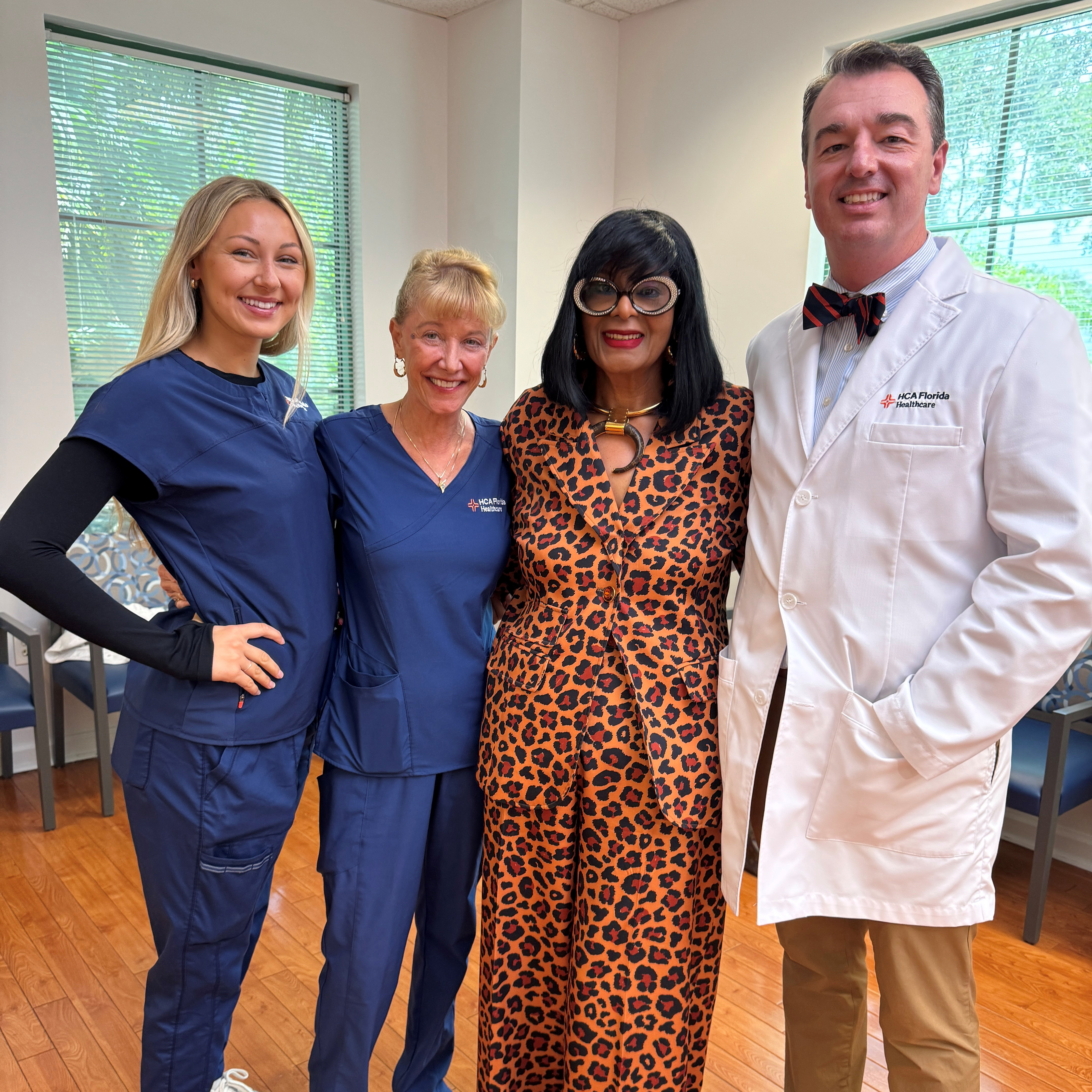 patient with two nurses and a surgeon