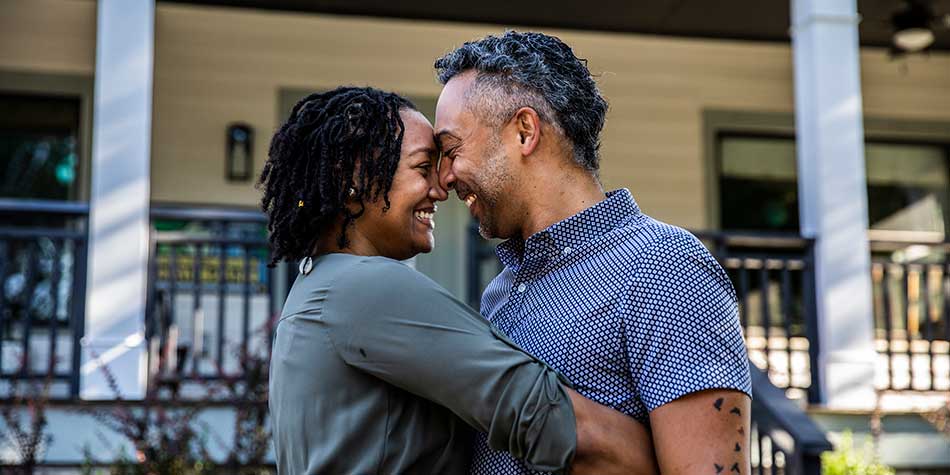 Man and woman embracing outdoors