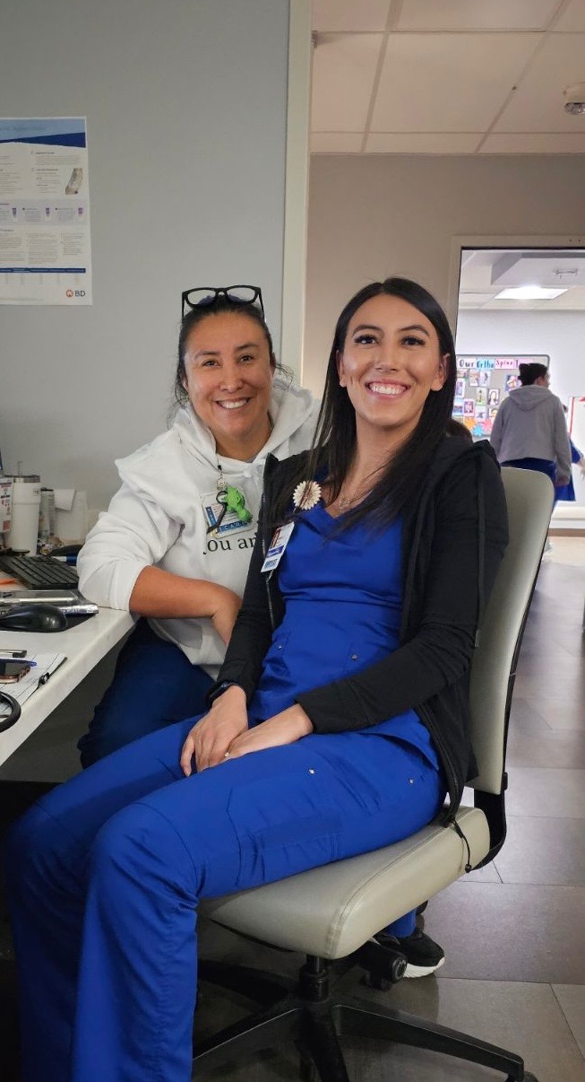 Mother and daughter who are nurses at a hospital.