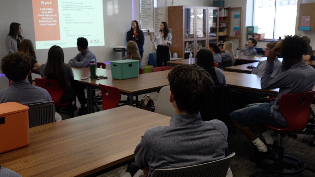 A group of high school students participate in a case study led by the team at HCA HealthONE Spalding Rehabilitation Hospital.