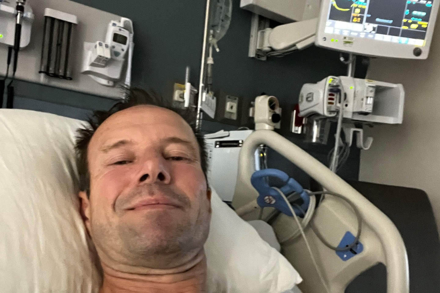 Miguel Janssen smiling in hospital bed