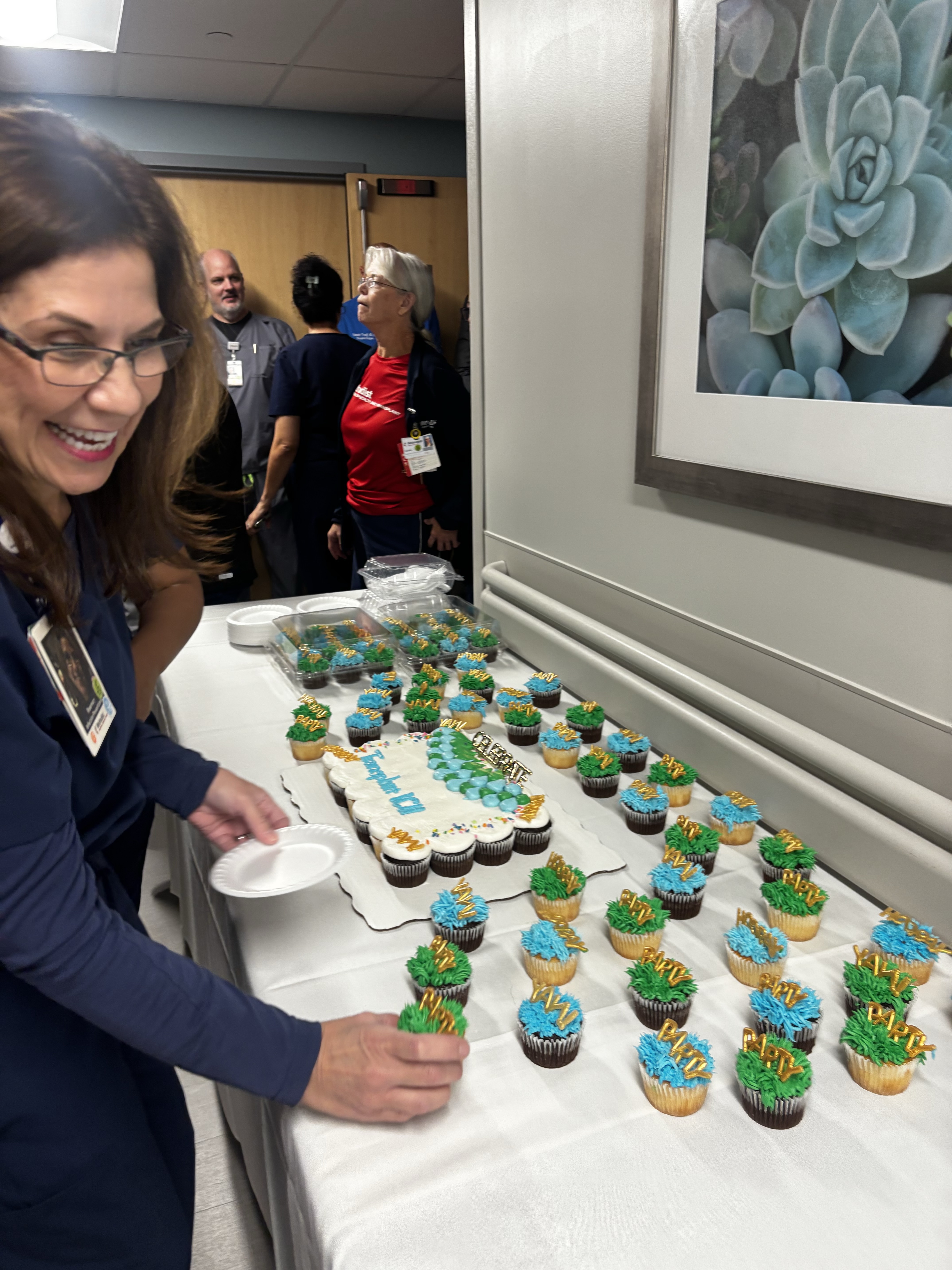 Staff enjoying cupcakes.