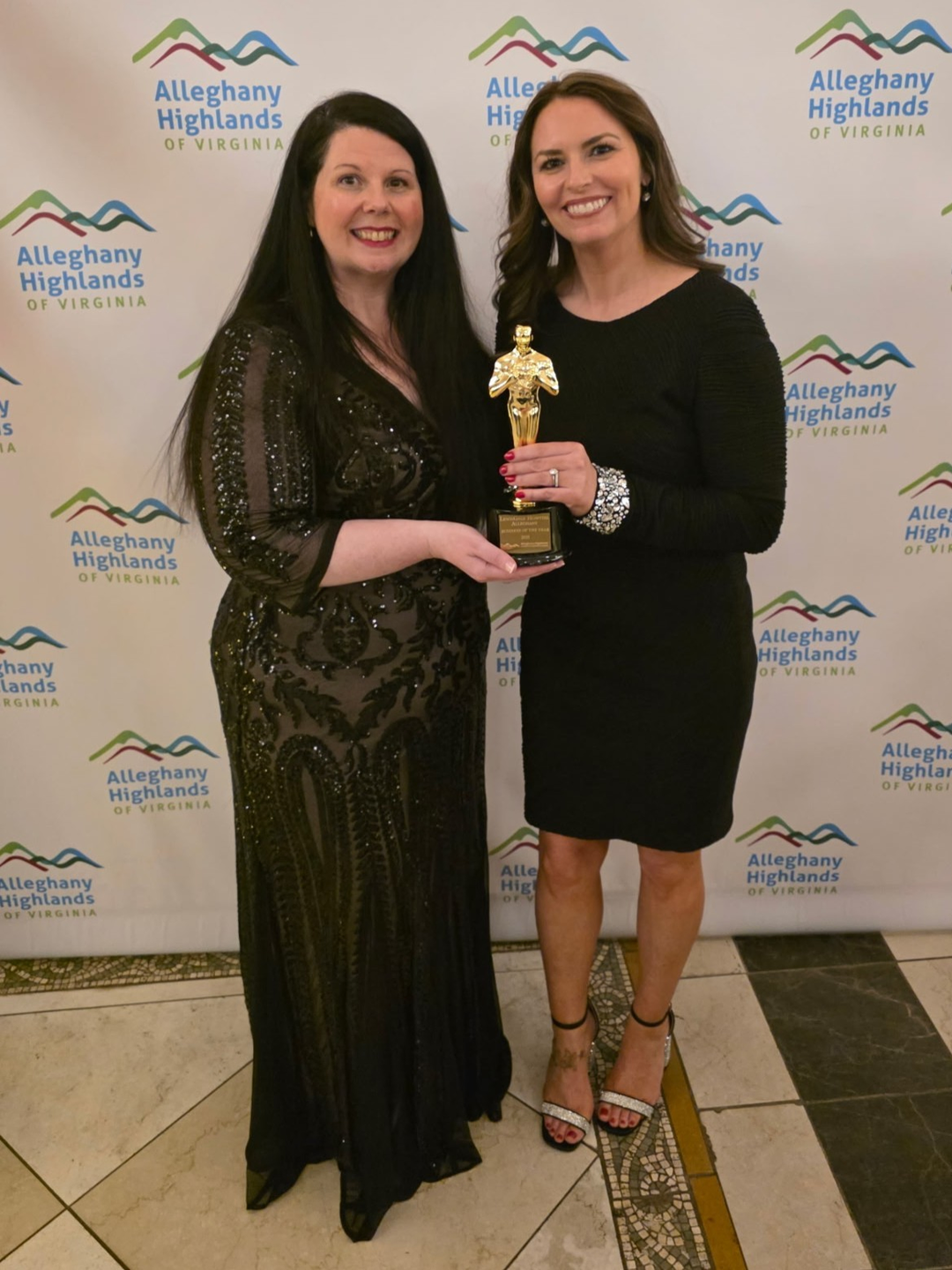 Erin Nicole posing with Business of the Year award