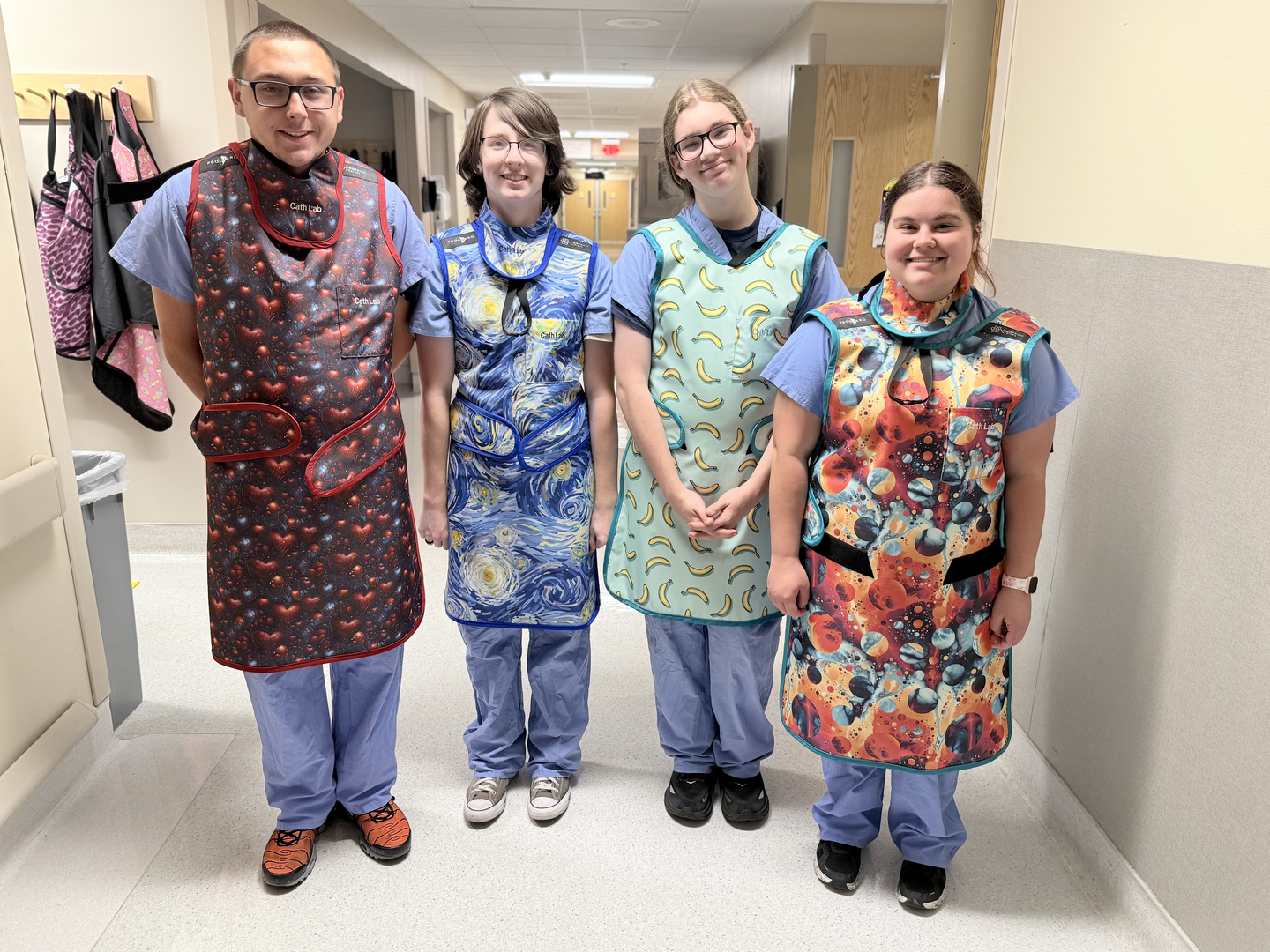Students try on lead aprons after visiting HCA Florida Citrus Hospital’s cardiac catheterization labs.