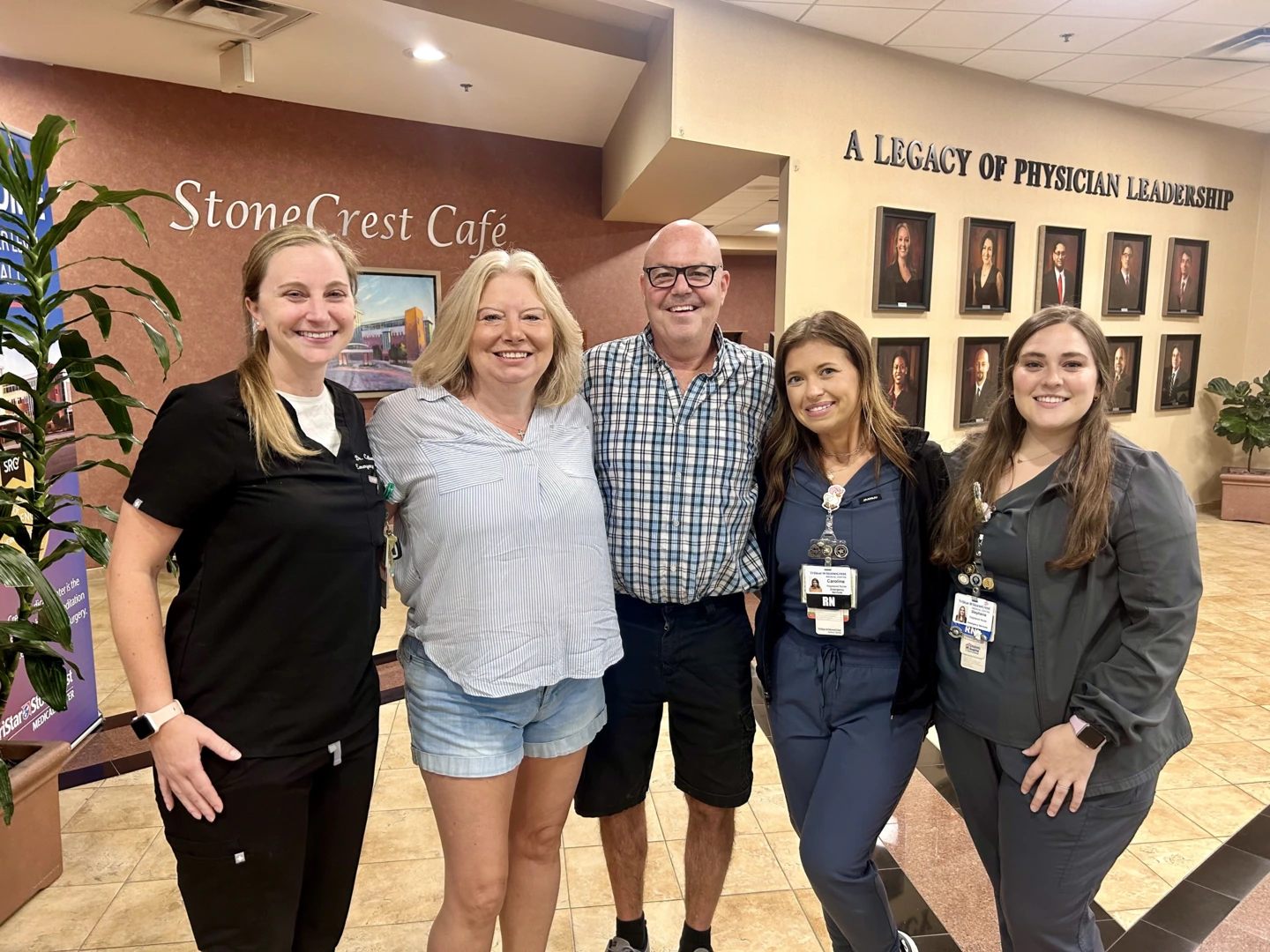 ER physician, Laura, Ken, and two of his nurses.